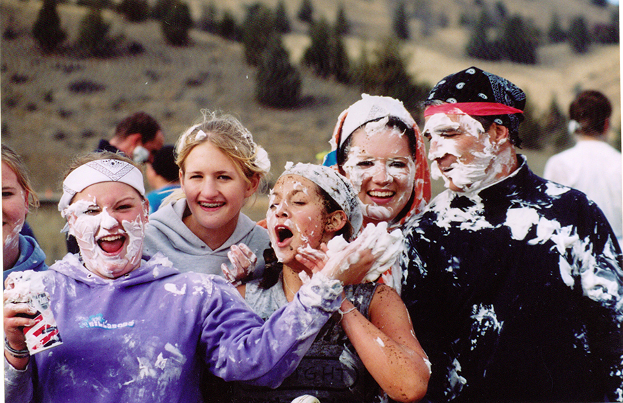 Wyldlife leader Krystina Bielemeier and her dad Neal Kuenzi (both at right), chaperone and survive a food fight with campers at Washington Family Ranch near Antelope, Oregon, shortly after its opening in 1999. 