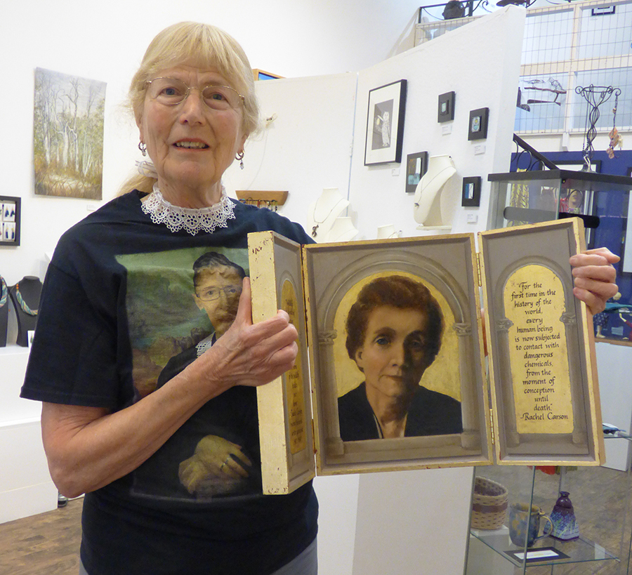 Anne Shams holding one of the portraits from her gallery show, “Portraits of Inspiring Women in the Classical Style Part One.” 