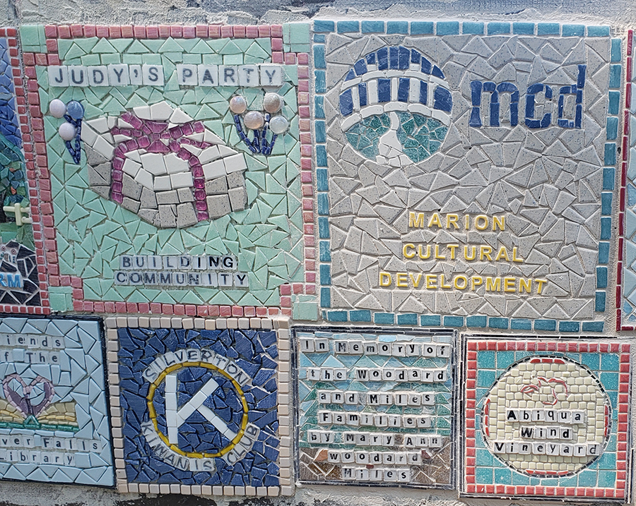 Local organizations and remembrances profiled on the fountain mosaic. 