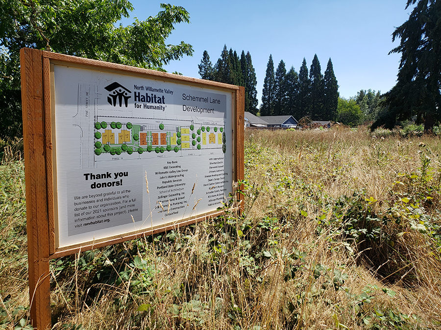 The sign at Peters’ Garden shows the layout of the planned 18-unit North Willamette Valley Habitat for Humanity Silverton project.  