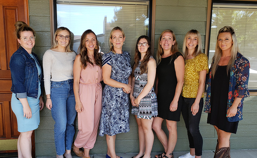 The Safety Compass staff outside of its office in Woodburn. The group recently received a $20,000 grant from the Oregon Community Foundation. From left, Chelsea Fife, Nina Dikova, Katherine Tate, Esther Nelson-Garrett, Shaila Oland, Steph Baker, Claire Vogelsang and Allie Martin. Not pictured is Mike Geiger.  