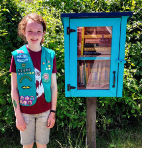 Moira MacDonald with her Little Free Library located at the Scotts Mills Grange.  