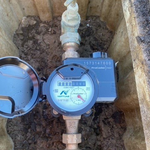 A radio-frequency identification (RFID) water meter.  
