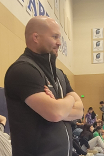 Foxes wrestling coach Jared Wilson observes a match during a five-way dual competition at Corvallis High. Submitted photo