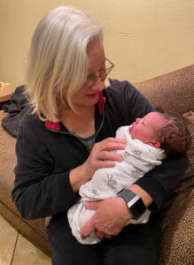 Teryl Grabeal holding her newborn grandson.  Melissa Wagoner