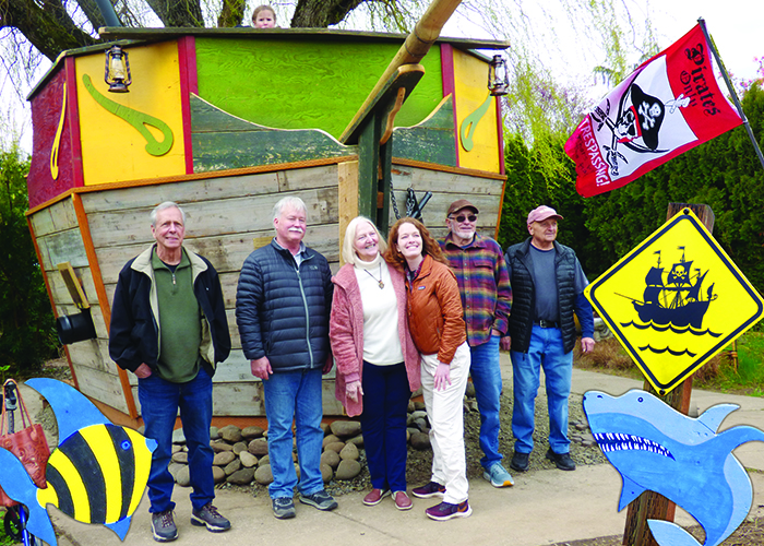 The pirate ship is launched by the volunteers who built it along with a representative from the Oregon State Federation of Garden Clubs, and Oregon Garden Director of Operations, Delen Kitchen (brown jacket). Melissa Wagoner