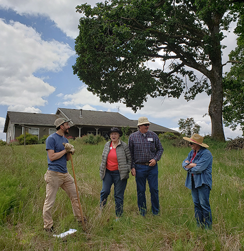 Kurt Berning, left, talks about the oak habitat projects he is running on his family’s property just outside of Mount Angel to a tour group. James Day