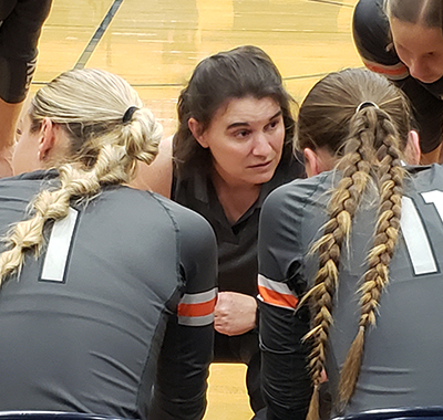 Foxes volleyball coach Kirsten Barnes talks to her squad during a timeout Sept. 19 at West Albany. Silverton fell to the Bulldogs in a spirited 4-set match but rebounded later in the week to down Corvallis 3-0 to move to 4-2 in Mid-Willamette play. James Day