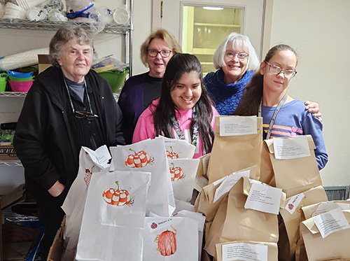 Silverton United Methodist Church’s Snack Sack group completes the week’s batch with help from students of Silverton’s Community Transition Program, also housed at the church. Front row, CTP students Paulina Rubio Saavedra and Kiele Pahia; back row, Luana Foster, Tally Stoffey and Donna Eberle. Not pictured, Carole Hogue. Brenna Wiegand