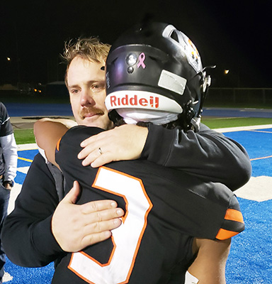 Foxes coach Dan Lever comforts senior Elijah Howard after Silverton fell to Mountain View of Bend 42-19 on Friday, Nov. 17 in the Class 5A semifinals. The Foxes have made it to the semis six times since 2012.   James Day
