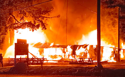 By the time firefighters arrived the store was fully engulfed in flames. SUBMITTED PHOTO