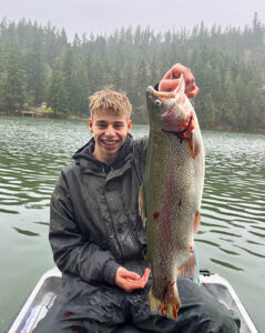 Javan Austin and his almost 7lb rainbow trout caught at the Silverton Reservoir. Submitted Photo. 