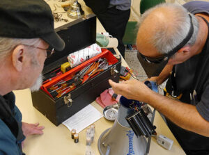 A volunteer works with a customer on a bullhorn at last year’s Repair Fair. This year’s event is Saturday, March 16, at the Silver Falls Public Library.   Submitted Photos