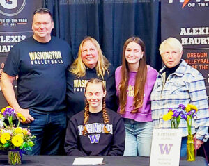 Silverton volleyball standout Alexis Haury is flanked by her parents, sister, Ella, and her grandmother on Feb. 12 at her signing ceremony. Haury will play college volleyball at the University of Washington. Submitted Photo
