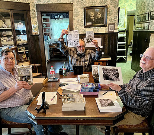 Silverton Country Historical Society authors Fred Parkinson, Gus Frederick, and Norm English meeting in the museum. Jeff Marcoe
