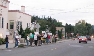 Protestors demonstrate prior to the Silverton City Council meeting in which Quikrete\'s application to locate in the city\'s industrial park was reaffirmed, with conditions. The operation qualifies as a permitted use under Silverton law, but opponents say there will be problems with dust and traffic.