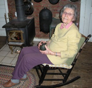 Vesper Geer Rose, 91, is decended from the pioneering Geer family who came to the Silverton Hills in 1847. She sits in a rocker and holds a small box that were stowed in the wagon that brought the Geers across the plains to Oregon Territory. These and other historical artifacts surround her in the 1851 house at GeerCrest Farm where she lives with her nephew, Jim Toler, and his wife, Erika.    