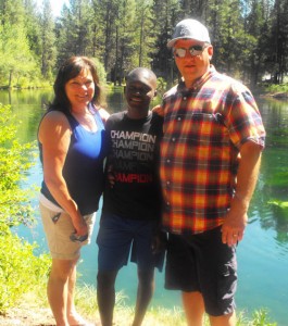 Kim and Russ Minten with their adopted son, Courage, at Wizard Falls Hatchery earlier this year..